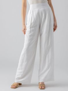 DETAILS Pleated Wide Leg Trousers with Elastic Back Waistband 2 Front and 2 Back Pockets Pull-On  Relaxed Fit SIZE + FIT Model is 5'8" and is wearing a size 27. Waist: 29 1/2" Front Rise: 13 1/4" Inseam: 32" Leg Opening: 24" FABRIC + CARE Shell: 54% Linen 46% Viscose Lining: 100% Cotton Polished Linen Machine Wash Cold, Hang to Dry Imported MADE WITH SUSTAINABILITY IN MIND Flax is the second most highly productive crop (after hemp). Flax can successfully grow without the use of herbicides and pesticides. The production uses little water which makes it the second most water efficient. Denim Jogger Pants, Athleisure Tops, Linen Blend Pants, Denim Outerwear, High Rise Pants, Skirt Leggings, Pesticides, Cotton Pants, Wide Leg Trousers