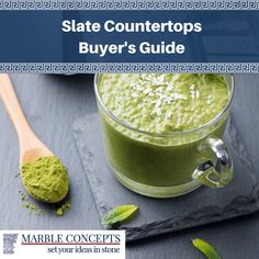 a green smoothie in a glass with a wooden spoon next to it and the title state countertops buyer's guide