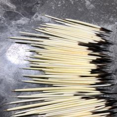 several toothpicks are lined up on a table