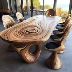 a large wooden table with chairs around it