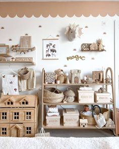 a room filled with lots of wooden toys and shelves on the wall next to each other