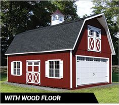 a red barn with white doors and windows