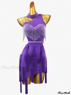 a mannequin wearing a purple dress with fringes