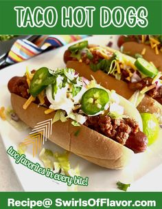 two chili dogs with jalapenos and cheese on them are sitting on a white plate