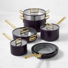 purple pots and pans with gold handles