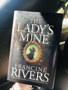 the lady's mine by francine rivers is held up to the camera