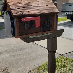 a mailbox with a house on it