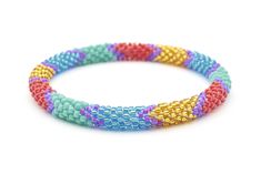 the multicolored beaded bracelet is shown on a white background