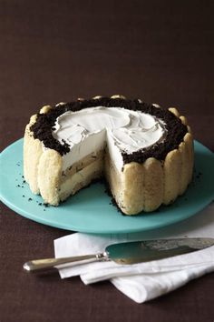 a chocolate and cream cheesecake on a blue plate