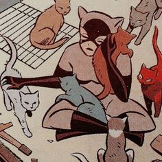 a woman sitting on the ground surrounded by cats