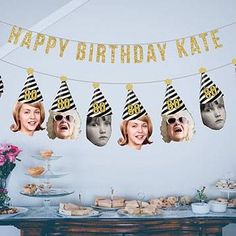 a birthday party with cake, cupcakes and bunting banner that says happy birthday kate