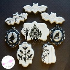 decorated cookies with black and white icing are arranged in the shape of halloween decorations