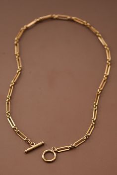 Meet the Lora Toggle Necklace—where classic design meets modern durability. This chunky, 18K gold-plated chain features bold rectangle + circle links for an elevated look, anchored by a chic front toggle clasp. Perfect for wearing solo to make a statement, or layering up for a personalized vibe. Crafted from non-tarnish, waterproof + sweatproof stainless steel, Lora is your go-to for every occasion, rain or shine. Style it with a simple tee for an effortless edge or with a blouse for a timeless Gold Chain Women, Necklace Styles, Chain Loop, Chain Women, Toggle Necklace, Affordable Fashion Women, Simple Tee, Simple Tees, Gold Necklaces