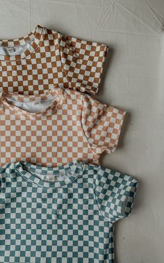 Introducing our adorable checkered short sleeve and short set for kids, the perfect addition to your little one's summer wardrobe! Made with high-quality, lightweight cotton material, this set is perfect for keeping your child comfortable and cool on warm days. The classic checkered design adds a fun and playful touch to the outfit, making it perfect for any casual occasion. The short sleeve shirt features a basic tee shirt, providing a smart and stylish look. The coordinating shorts have an ela Casual Cotton Gingham Sets, Casual Gingham Cotton Sets, Summer Plaid Short Sleeve Sets, Summer Plaid Sets With Short Sleeves, Casual Plaid Sets For Summer, Casual Plaid Summer Sets, Casual Summer Plaid Sets, Summer Gingham Short Sleeve Sets, Summer Gingham Sets With Short Sleeves