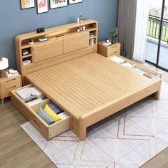 a bed with drawers underneath it and pictures on the wall behind it in a bedroom