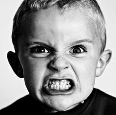 a black and white photo of a young boy with his mouth open, saying mama no me disffraces mas solo quero ropa de sophie