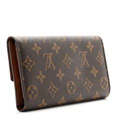 This is an authentic LOUIS VUITTON Monogram Porte Tresor International Wallet. This chic wallet is crafted of signature Louis Vuitton monogram on toile canvas. The wallet snaps open to a brown cross-grain leather interior with card slots, bill pockets, a flap compartment, and a pen holder. Louis Vuitton Wallet, A Pen, Card Holder Wallet, Pen Holder, Pen Holders, Leather Interior, Authentic Louis Vuitton, Louis Vuitton Monogram, Card Slots