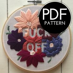 an embroidery pattern with flowers on it