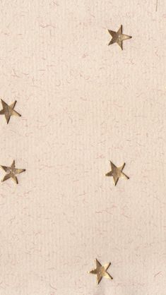 four gold stars on a white background