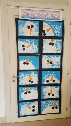 a door decorated to look like a snowman with many different images on it and the words winter wonderland written in black