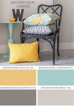 a chair with yellow and blue pillows in front of it, next to a shelf