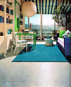 a living room filled with furniture and a blue rug