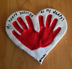 a handprinted heart on a wooden table