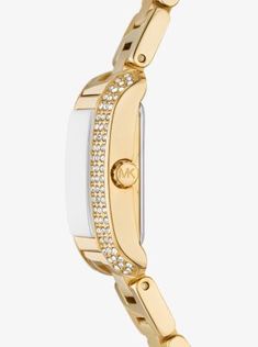 Delicate lines of pavé crystals add shine to the rectangular face of our mini Emery watch. The polished, beveled strap is made of gold-tone stainless steel, while the dial features Roman numeral indices for an elegant finish. Glamorous enough to pair with evening looks yet understated enough to complement a simple T-shirt and jeans, this is a timeless style you’ll never want to take off. Rectangular Face, Simple T Shirt, Simple Tshirt, Roman Numeral, T Shirt And Jeans, Luxe Gifts, Roman Numerals, Gold Watch, Timeless Style