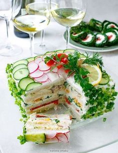 a layered cake with cucumbers, radishes and other veggies