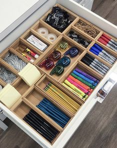 an open drawer with many different items in it