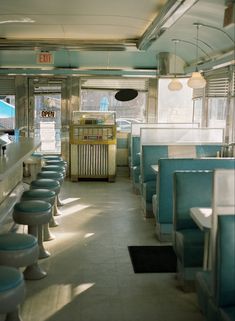 the interior of a diner with blue seats