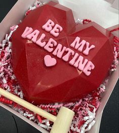 a heart shaped cake with the words be my valentine on it