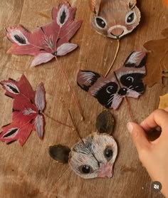 someone is making some paper flowers out of leaves and other things that are on the table