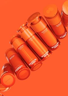 an orange background with many different types of containers and lids on each side, all in the same row