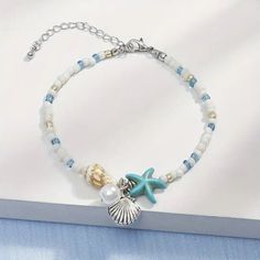 This charming bracelet features a beautiful starfish design, adding a touch of beachy elegance to any outfit. The braided chain is strong and durable, ensuring it will last for years to come. The wrap style is perfect for layering with other bracelets, creating a unique and personalized look. Crafted with high-quality materials, this bracelet is a must-have for any fashion-forward individual. Its versatile style makes it an ideal accessory for both casual and formal occasions, making it a great addition to any jewelry collection. With its unique design and durable construction, this starfish braided bracelet is sure to become a staple in your wardrobe. Starfish Bracelet, Beach Bracelets, Starfish Pendant, Friendship Jewelry, Summer Bracelets, Shell Bracelet, Summer Necklace, Birthday Jewelry Gift, Cute Bracelets