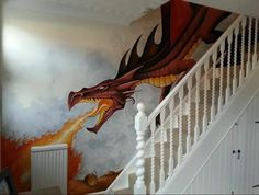 a staircase painted with a dragon on the wall and fire coming out of its mouth