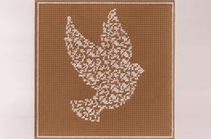 a cross - stitch pattern of a bird on brown background