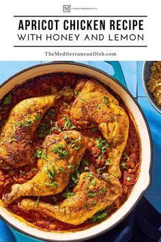 chicken dish with honey and lemon served in a white pan on a blue tablecloth