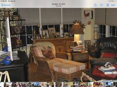 a living room filled with furniture and lots of windows