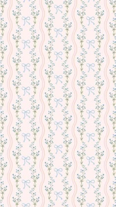 a pink and blue wallpaper with small flowers on the bottom half of it,