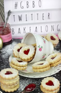 heart shaped cookies on a plate with jam in the middle