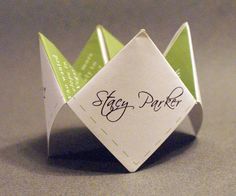 an origami paper crown with the word stay pretty written on it