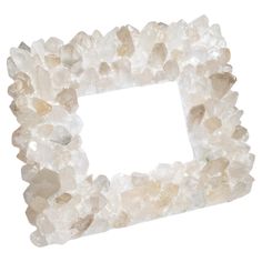 a frame made out of rocks on a white background