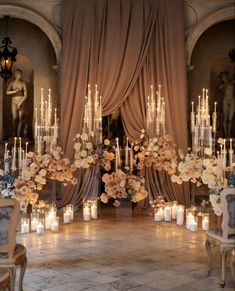 an elegant wedding setup with candles and flowers