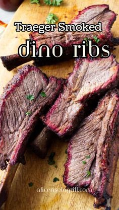 Dino Ribs, big beef short ribs, smoked on a Traeger, carved and ready to serve on a wood board. Short Ribs Smoker Recipe, Slow Cooked Steak, Beef Plate Ribs, Grilled Beef Short Ribs, Traeger Grill Recipes