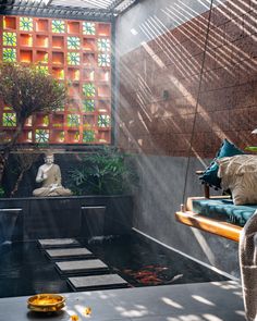 a buddha statue sitting in the middle of a room