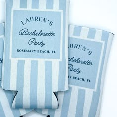 three blue and white striped bags with labels on them