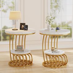 two side tables with marble top and gold metal legs, one has a lamp on it