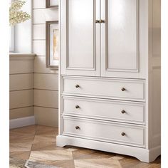 a white armoire with drawers in a room