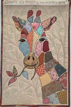 a quilted giraffe with many different colored patches on it's face